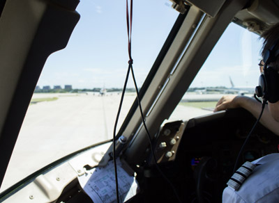 Airline pilot taxiing an airplane