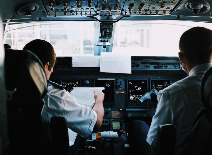 Pilots in Airplane Flight Deck